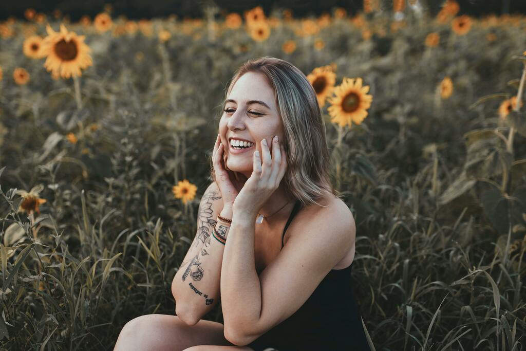 Woman among sunflowers